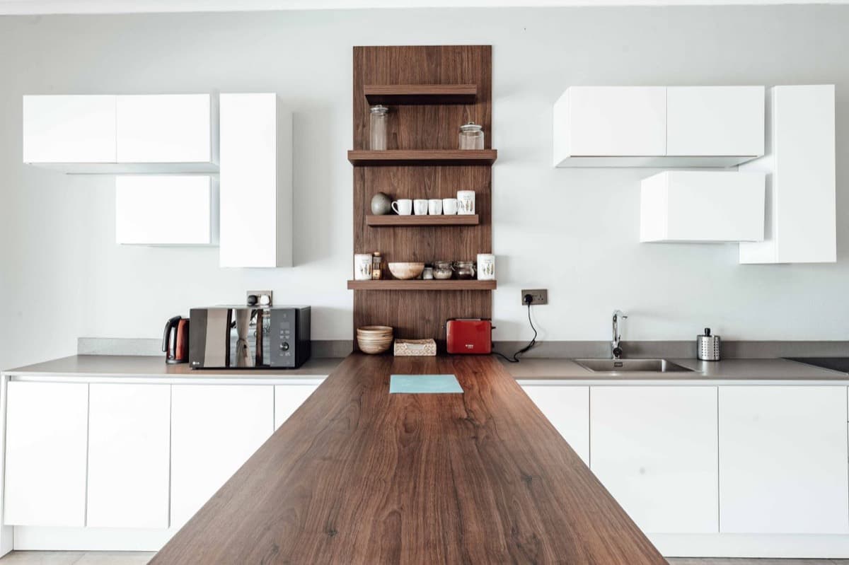 Furnished kitchen in a London residential unit set up to an operational, guest-ready standard
